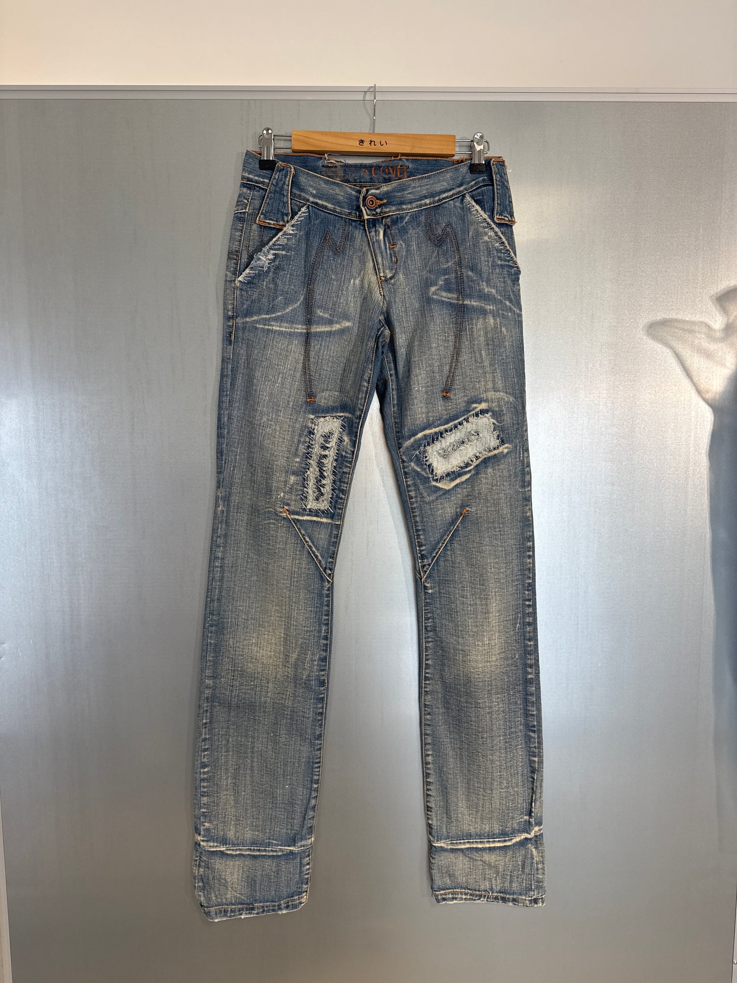 The Cutline Distressed Jeans by Enrico Coveri